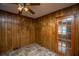 Cozy dining area with wood paneled walls and a ceiling fan with lights. Perfect for Gathering meals at 100 S Gum St, Summerville, SC 29483