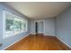 Bright living room with hardwood floors and large windows offering plenty of light at 100 S Gum St, Summerville, SC 29483