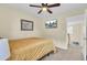 Cozy bedroom with ceiling fan, TV, and neutral color scheme at 103 Trimley Ct, Goose Creek, SC 29445