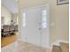 Bright foyer with a tile floor, a white front door, and views into the dining area at 103 Trimley Ct, Goose Creek, SC 29445