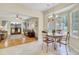 Bright kitchen with tile floors and an eat-in area that connects to the adjacent living room at 103 Trimley Ct, Goose Creek, SC 29445