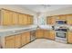 Functional kitchen with wooden cabinets, stainless steel appliances, and granite countertops, ready for culinary adventures at 103 Trimley Ct, Goose Creek, SC 29445
