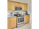 Well-equipped kitchen featuring stainless steel appliances and light wood cabinets at 103 Trimley Ct, Goose Creek, SC 29445