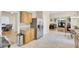 Open kitchen with stainless steel refrigerator and view of the living room and dining room at 103 Trimley Ct, Goose Creek, SC 29445