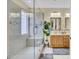 Main bathroom featuring a glass enclosed shower with seat and double sink vanity with great lighting at 103 Trimley Ct, Goose Creek, SC 29445