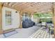 Inviting backyard patio with a pergola, grill, and cozy seating at 103 Trimley Ct, Goose Creek, SC 29445