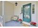 Inviting front porch with a cozy bench, decorative pillows, and charming flower pots welcoming visitors at 103 Trimley Ct, Goose Creek, SC 29445