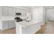 Modern kitchen featuring stainless steel appliances, a large island, and ample cabinet space at 107 Lefton Lndg, Summerville, SC 29485