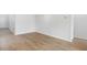 Open concept room with hardwood floors and white walls, a blank canvas for any style at 107 Lefton Lndg, Summerville, SC 29485