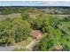 Overhead view of a charming house surrounded by lush trees and marshland, offering privacy and natural beauty at 1102 N Shadow Dr, Mount Pleasant, SC 29464