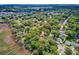 Aerial view showcasing a neighborhood abundant with mature trees near a marshy waterfront area at 1102 N Shadow Dr, Mount Pleasant, SC 29464