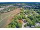 Beautiful aerial view of marsh-front home with lush trees and natural surroundings in a serene setting at 1102 N Shadow Dr, Mount Pleasant, SC 29464
