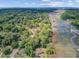 Stunning aerial view of lush community near winding marsh and waterway under bright blue sky at 1102 N Shadow Dr, Mount Pleasant, SC 29464