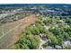 Sweeping aerial view of lovely homes nestled in established, verdant neighborhood close to marshland at 1102 N Shadow Dr, Mount Pleasant, SC 29464