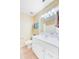 Bathroom with white vanity, large mirror, and ample counter space for storage at 1102 N Shadow Dr, Mount Pleasant, SC 29464