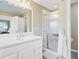 Bright bathroom with vanity and a shower over tub combo with glass enclosure at 1102 N Shadow Dr, Mount Pleasant, SC 29464