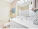 Bathroom with white vanity, large mirror, and ample counter space for storage at 1102 N Shadow Dr, Mount Pleasant, SC 29464