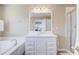 Bright bathroom with vanity and a shower over tub combo with glass enclosure at 1102 N Shadow Dr, Mount Pleasant, SC 29464