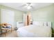 Cozy bedroom with neutral walls, large window, and a white ceiling fan at 1102 N Shadow Dr, Mount Pleasant, SC 29464