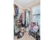 Walk-in closet with wire shelving, filled with an array of clothing and accessories at 1102 N Shadow Dr, Mount Pleasant, SC 29464
