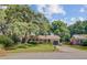 Charming single story brick home with cozy porch, attached garage and mature landscaping at 1102 N Shadow Dr, Mount Pleasant, SC 29464