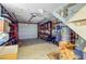 Cluttered two-car garage with shelves, tools, and storage, offering potential for organization at 1102 N Shadow Dr, Mount Pleasant, SC 29464