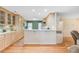 Spacious kitchen featuring wood floors, light wood cabinetry, stainless appliances, and an island at 1102 N Shadow Dr, Mount Pleasant, SC 29464