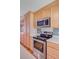 Kitchen with stainless steel appliances, wooden cabinets, and a built-in microwave at 1102 N Shadow Dr, Mount Pleasant, SC 29464
