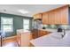 Open kitchen featuring stainless appliances, light countertops, wood cabinetry, and natural light at 1102 N Shadow Dr, Mount Pleasant, SC 29464