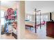 Spacious main bedroom featuring a four-poster bed, closet, and ceiling fan at 1102 N Shadow Dr, Mount Pleasant, SC 29464