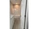Well-lit bathroom with a vanity, granite countertop, and tiled floors at 110A Dukes St, Saint George, SC 29477