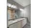 Bathroom featuring a granite countertop double vanity and modern lighting at 110A Dukes St, Saint George, SC 29477