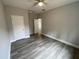 Spacious bedroom featuring hardwood flooring and a ceiling fan for added comfort at 110A Dukes St, Saint George, SC 29477