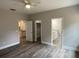 Bedroom with hardwood floors, providing access to kitchen and bathroom at 110A Dukes St, Saint George, SC 29477