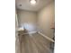 Convenient laundry room with a built-in counter and hardwood floors at 110A Dukes St, Saint George, SC 29477