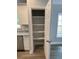 Convenient walk-in kitchen pantry with shelving offers ample storage at 110A Dukes St, Saint George, SC 29477