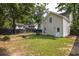 Well-maintained lawn in a home backyard, featuring a privacy fence and lush trees at 1116 Sea Island Crossing Ln, Mount Pleasant, SC 29464