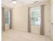 Comfortable bedroom with neutral walls, carpet, and large windows at 1116 Sea Island Crossing Ln, Mount Pleasant, SC 29464