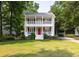Charming two-story home with double porches and lush landscaping at 1116 Sea Island Crossing Ln, Mount Pleasant, SC 29464
