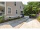 Home exterior featuring a driveway, siding, windows, and access to a screened porch at 1116 Sea Island Crossing Ln, Mount Pleasant, SC 29464