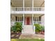 Close-up of the front porch, featuring a vibrant red door at 1116 Sea Island Crossing Ln, Mount Pleasant, SC 29464