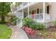 Inviting home entrance with double porches and beautiful landscaping at 1116 Sea Island Crossing Ln, Mount Pleasant, SC 29464