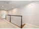 Hallway with carpet, white railing and new neutral paint offers a calm transition at 1116 Sea Island Crossing Ln, Mount Pleasant, SC 29464