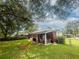 Backyard featuring a covered patio, chain-link fence, and lush grass at 116 Lyle Rd, Goose Creek, SC 29445