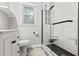 Modern bathroom featuring a glass shower, white subway tile, black hardware, and a decorative tiled floor at 116 Lyle Rd, Goose Creek, SC 29445