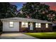 Charming brick ranch-style home with a well-manicured lawn and mature trees creating a serene atmosphere at 116 Lyle Rd, Goose Creek, SC 29445