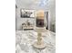 The kitchen island with a white candle stand features a stunning marbled countertop at 116 Lyle Rd, Goose Creek, SC 29445