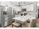 Modern kitchen with white cabinets, stainless steel appliances, and granite countertops at 116 Lyle Rd, Goose Creek, SC 29445