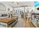 Inviting living room seamlessly flows into a modern, white kitchen with breakfast bar seating at 116 Lyle Rd, Goose Creek, SC 29445