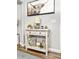 Console table with stylish lamp and decorations against gray wall, complemented by wood floors at 116 Lyle Rd, Goose Creek, SC 29445